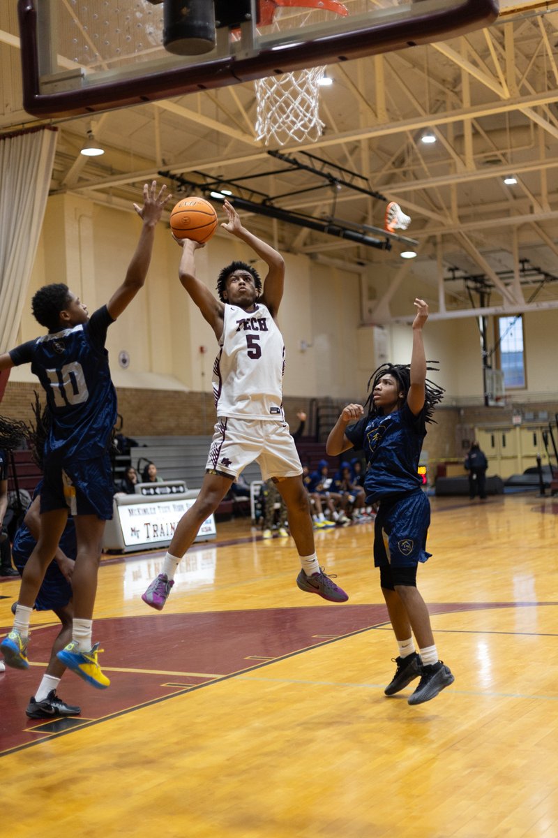 Basketball player going up for a layup